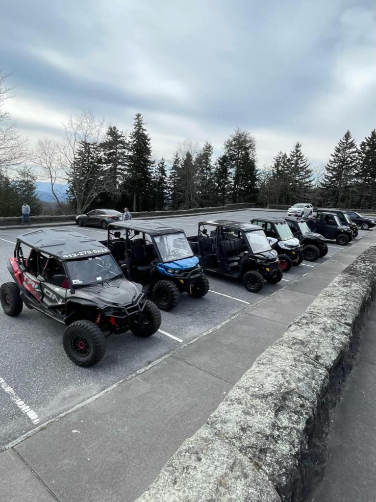 Group of utv vechiles in a parking lot