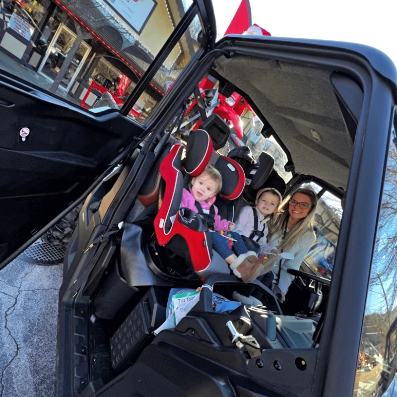 Family aboard a street-legal UTVs