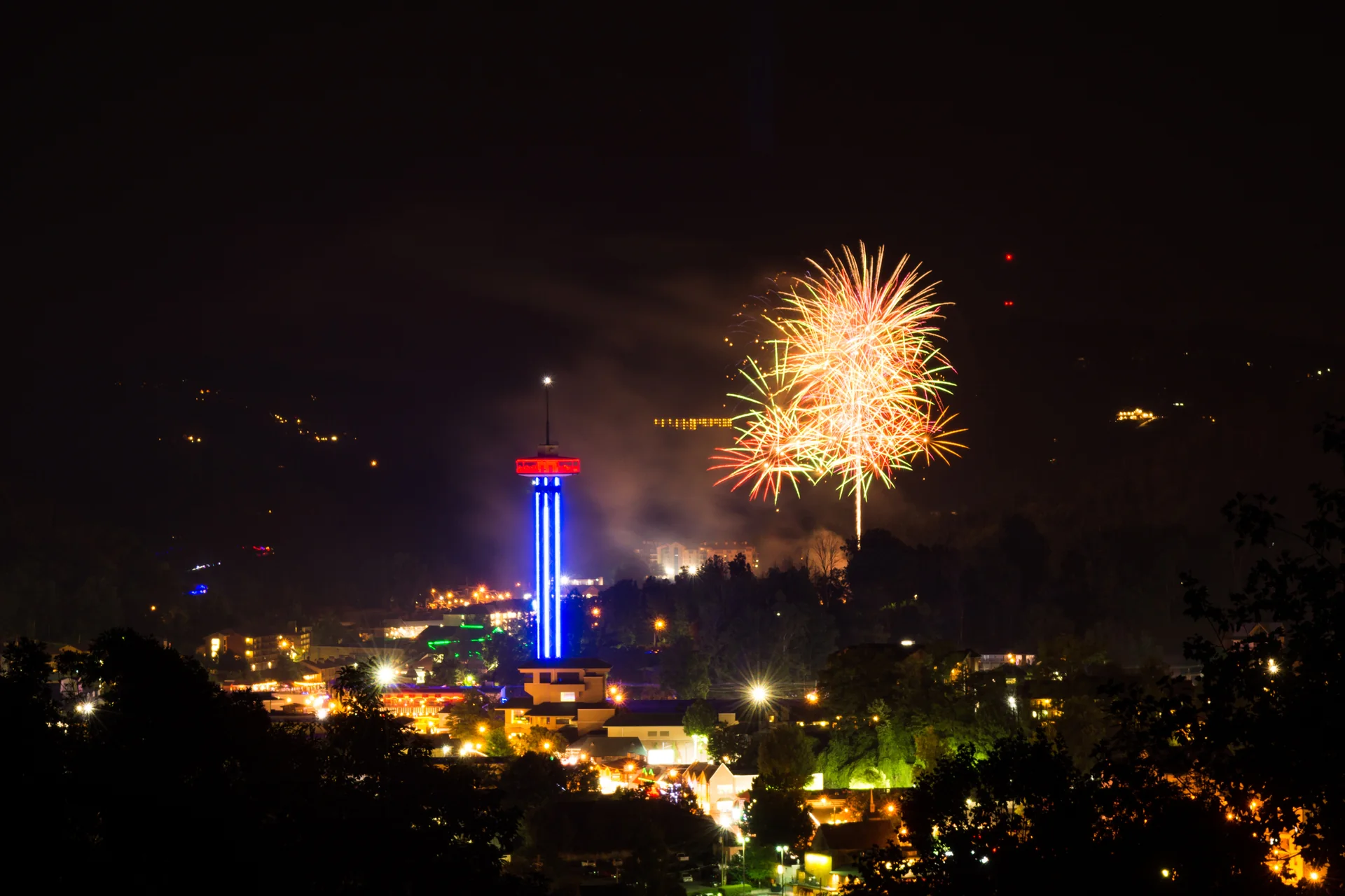 Fireworks lighting up the sky over Gatlinburg during an evening celebration