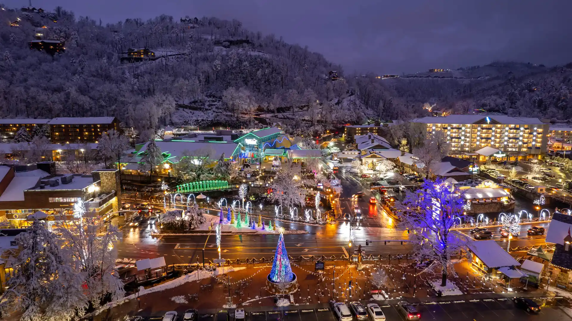 Snowy Gatlinburg strip decorated with Christmas lights during the holiday season