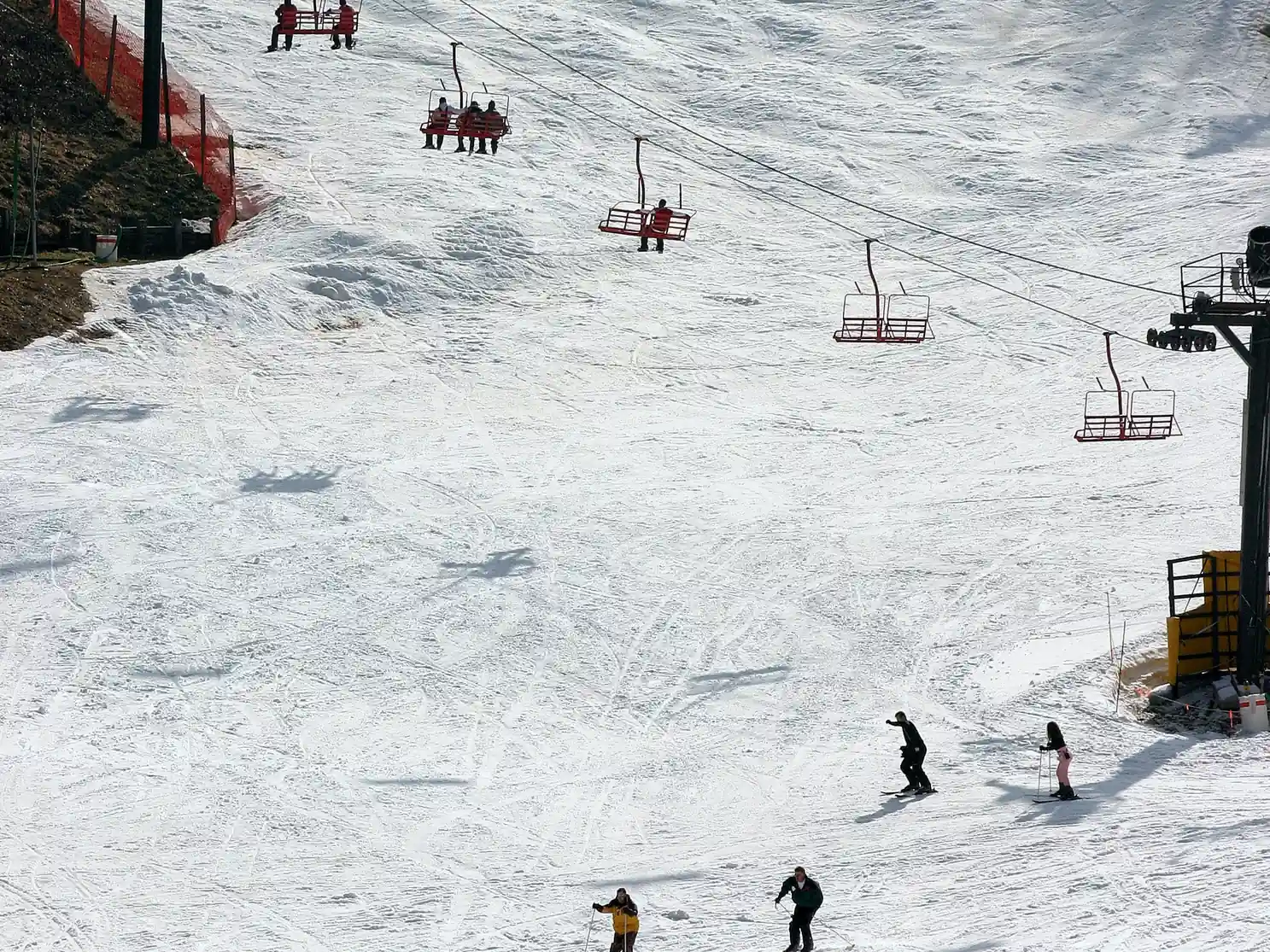 Skiers on the chairlift and slopes at Ober Mountain, a festive Gatlinburg winter activity