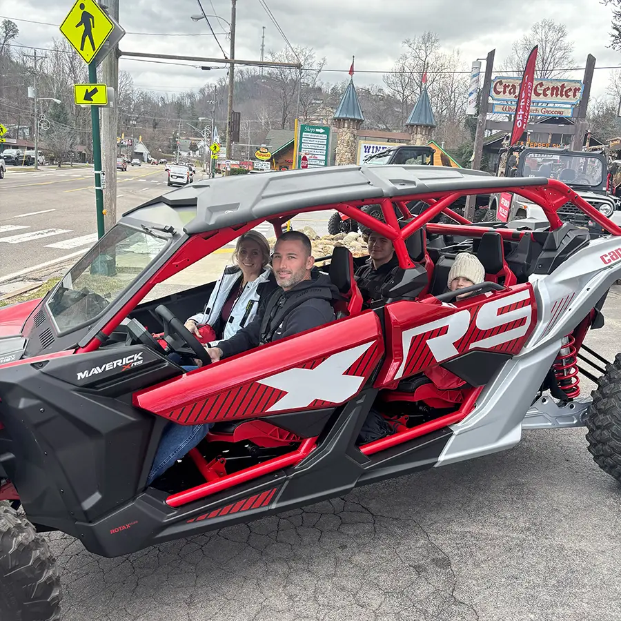 Family in a Can-Am Maverick side-by-side