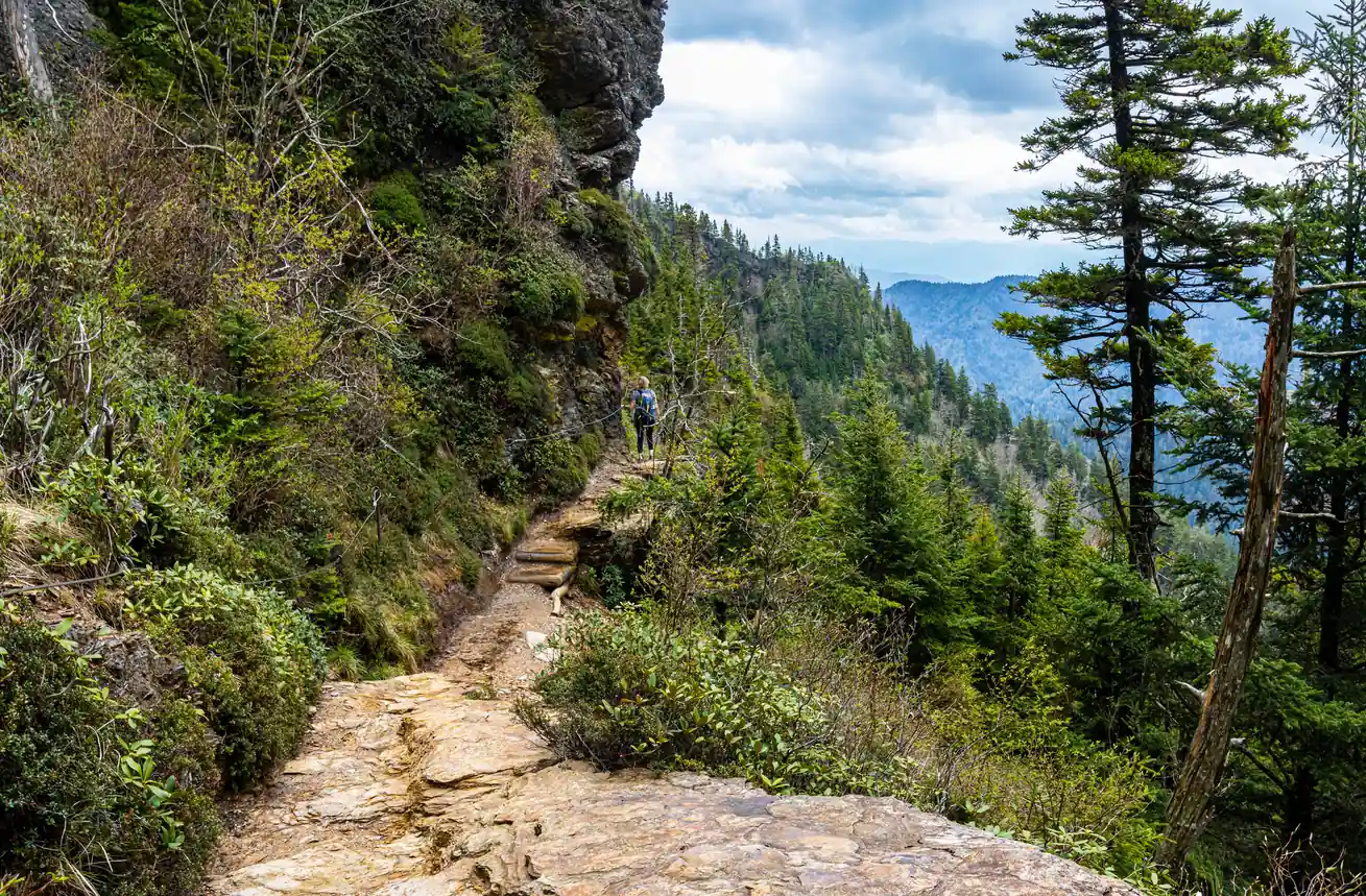 Female hiker on the Alum Cave Trail, a popular Smokies spring break activity
